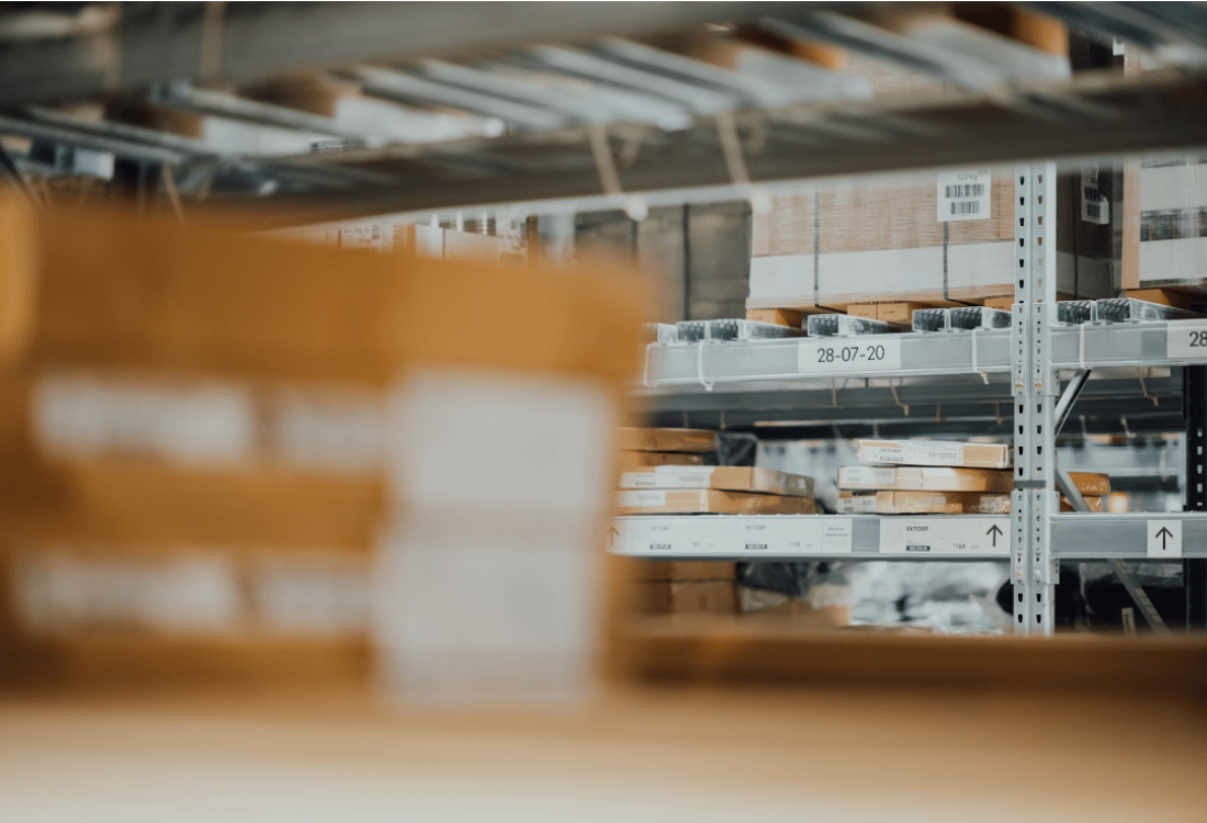 Boxes sit stacked on metal shelves, warehouse automation will allow robots to pick these boxes.